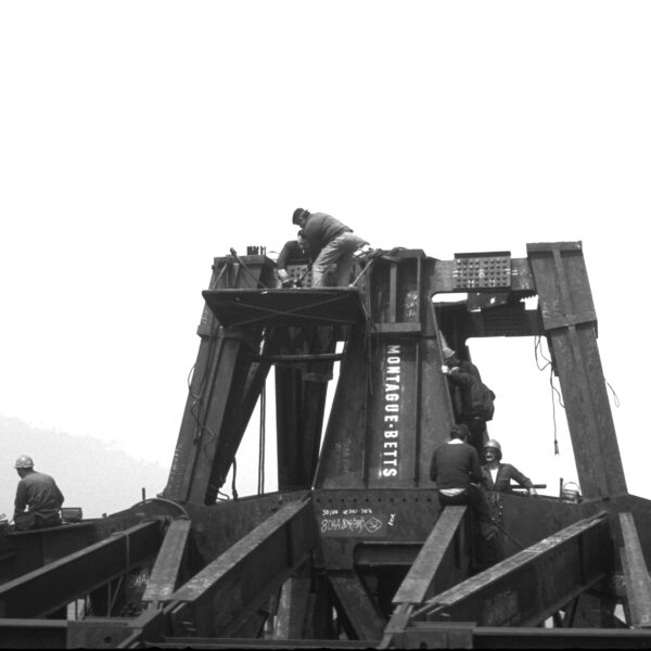 Photograph in black and white of the steel work that will support the antenna of the North Tower