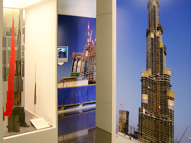 Gallery view of the wind tunnel models and construction photographs of the Burj Khalifa.